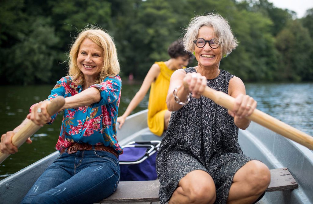 Women Rowing in Boat